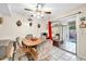 Comfortable dining area with sliding glass doors offering natural light and outdoor views at 13428 N Hawthorn Dr, Sun City, AZ 85351