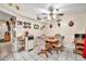 Cozy dining area featuring a ceiling fan and a traditional table setting at 13428 N Hawthorn Dr, Sun City, AZ 85351