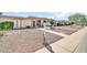 Charming single-level home with a xeriscaped front yard and a welcoming entrance at 13428 N Hawthorn Dr, Sun City, AZ 85351