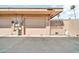 Exterior view of tan garage with gate featuring a moon and cat design at 13428 N Hawthorn Dr, Sun City, AZ 85351