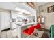 Modern kitchen with a center island, white cabinetry, and granite countertops at 13428 N Hawthorn Dr, Sun City, AZ 85351