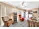 Bright living room with white ceiling fan, neutral walls, and sliding glass doors for lots of natural light at 13428 N Hawthorn Dr, Sun City, AZ 85351
