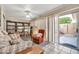 Comfortable living room with lots of natural light coming from a sliding glass door and open layout at 13428 N Hawthorn Dr, Sun City, AZ 85351