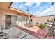 Private tiled back patio with outdoor seating provides a perfect spot for relaxation and al fresco dining at 13428 N Hawthorn Dr, Sun City, AZ 85351