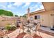 Outdoor tiled patio with chairs, small dining table, and grill is ready for entertaining or relaxing at 13428 N Hawthorn Dr, Sun City, AZ 85351