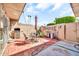 Tiled backyard patio space has plenty of room for outdoor activities and relaxing at 13428 N Hawthorn Dr, Sun City, AZ 85351