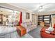 Enclosed sun room offers tiled floor and sliding glass doors for a bright and airy bonus space at 13428 N Hawthorn Dr, Sun City, AZ 85351
