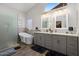 Luxurious bathroom with a soaking tub, walk-in shower, and dual vanity sinks, offering a spa-like experience at 14835 N 41St Pl, Phoenix, AZ 85032
