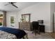 Bright bedroom featuring a stylish dresser and workspace, offering comfort and functionality at 14835 N 41St Pl, Phoenix, AZ 85032