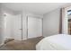 Carpeted bedroom features a sliding closet at 14835 N 41St Pl, Phoenix, AZ 85032
