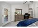 Serene bedroom featuring a stylish dresser and workspace, offering comfort and functionality at 14835 N 41St Pl, Phoenix, AZ 85032