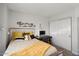 Bedroom with a queen bed, desk, and closet at 14835 N 41St Pl, Phoenix, AZ 85032