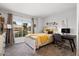 Bedroom with a window, desk, and queen bed at 14835 N 41St Pl, Phoenix, AZ 85032