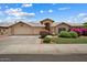 Charming single-story home featuring a well-manicured lawn and attached two-car garage at 14835 N 41St Pl, Phoenix, AZ 85032