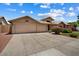 Attractive single-story home with a two-car garage and a beautifully landscaped front yard at 14835 N 41St Pl, Phoenix, AZ 85032