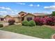 Beautiful single-story home with lush landscaping and a well-maintained lawn at 14835 N 41St Pl, Phoenix, AZ 85032