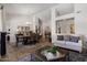 Elegant living room and dining area with stylish furniture and an open layout, perfect for entertaining at 14835 N 41St Pl, Phoenix, AZ 85032