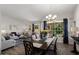 Inviting living room and dining area with hardwood floors and plenty of natural light at 14835 N 41St Pl, Phoenix, AZ 85032
