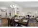 Open concept living and dining area with elegant decor and plenty of space for entertaining at 14835 N 41St Pl, Phoenix, AZ 85032