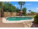 Inviting backyard pool with a desert landscape and a seating area, perfect for relaxation and entertainment at 14835 N 41St Pl, Phoenix, AZ 85032