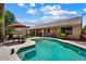 Beautiful backyard pool with seating area and covered patio, ideal for outdoor living and enjoyment at 14835 N 41St Pl, Phoenix, AZ 85032