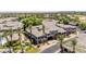 Drone shot shows an overview of the complex's desert landscaping and parking at 15221 N Clubgate Dr # 2139, Scottsdale, AZ 85254