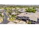 Drone shot shows an overview of the complex's swimming pool and desert landscaping at 15221 N Clubgate Dr # 2139, Scottsdale, AZ 85254
