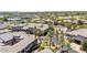 Aerial shot of luxury residences showcasing roof lines, palm trees, and meticulously maintained landscaping at 15221 N Clubgate Dr # 2139, Scottsdale, AZ 85254