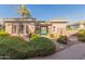 Exterior view of the community clubhouse with lush landscaping, creating a welcoming atmosphere at 15221 N Clubgate Dr # 2139, Scottsdale, AZ 85254