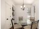 Bright dining area featuring a glass table, comfortable seating, and decorative lighting at 15221 N Clubgate Dr # 2139, Scottsdale, AZ 85254