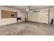 Spacious two car garage with work space and overhead lighting, perfect for storage or hobbies at 15221 N Clubgate Dr # 2139, Scottsdale, AZ 85254