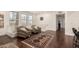 Living room featuring hardwood floors and ample natural light from large windows at 15221 N Clubgate Dr # 2139, Scottsdale, AZ 85254