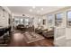 Bright living room with hardwood floors, fireplace, and large windows offering ample natural light at 15221 N Clubgate Dr # 2139, Scottsdale, AZ 85254