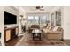Cozy living room with fireplace, plush seating, and plenty of natural light at 15221 N Clubgate Dr # 2139, Scottsdale, AZ 85254
