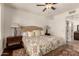 Bright main bedroom features a neutral color palette, ceiling fan, and carpeted floor at 15221 N Clubgate Dr # 2139, Scottsdale, AZ 85254