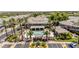 Aerial view of a resort-style community pool with palm trees, lounge chairs, and shaded cabana at 15221 N Clubgate Dr # 2139, Scottsdale, AZ 85254