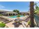 Resort-style community pool with ample seating and lush landscaping, creating a serene oasis at 15221 N Clubgate Dr # 2139, Scottsdale, AZ 85254