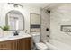 The bathroom features a tile shower, modern fixtures, and neutral color palette at 1611 W Palomino Dr, Chandler, AZ 85224