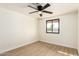 An airy bedroom with a ceiling fan, window, and hardwood floors offers a calming retreat at 1611 W Palomino Dr, Chandler, AZ 85224