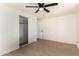 Rest and relax in this bedroom featuring hardwood floors, closet, and ceiling fan at 1611 W Palomino Dr, Chandler, AZ 85224