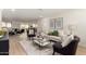 Bright living room with wood floors, modern furnishings, and an open floor plan at 1611 W Palomino Dr, Chandler, AZ 85224