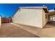 Side yard with concrete driveway, privacy gate, and exterior view of the home at 1611 W Palomino Dr, Chandler, AZ 85224