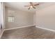 This bedroom features neutral paint, tile flooring and a ceiling fan at 16217 N 154Th Dr, Surprise, AZ 85374