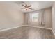 This bedroom features neutral paint, carpet flooring and a ceiling fan at 16217 N 154Th Dr, Surprise, AZ 85374