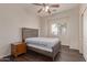 Bedroom with hardwood floors, a ceiling fan, and natural light from the window at 16217 N 154Th Dr, Surprise, AZ 85374