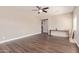 Bedroom with beautiful wood floors, ceiling fan, and light tan walls at 16217 N 154Th Dr, Surprise, AZ 85374