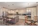 Open eat-in kitchen featuring granite counters, stainless appliances, and custom cabinets at 16217 N 154Th Dr, Surprise, AZ 85374