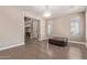 Spacious living room with hardwood floors, a crystal chandelier and a view of the home's entrance at 16217 N 154Th Dr, Surprise, AZ 85374