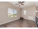 Upstairs loft featuring hardwood floors, large windows, and outside views at 16217 N 154Th Dr, Surprise, AZ 85374