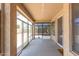 Enclosed sun room featuring multiple sliding glass doors and windows for maximum natural light at 16217 N 154Th Dr, Surprise, AZ 85374